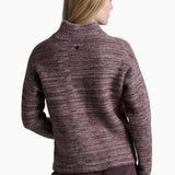 Woman wearing a maroon sweater and pants on a white background