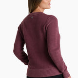 Woman wearing a maroon sweater on a white background