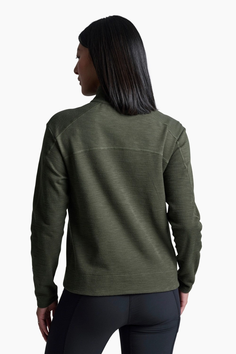 Person wearing a green fleece jacket on a white background