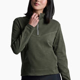 Woman wearing a green pullover with a zipper on a white background