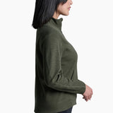 Woman wearing a green long-sleeve top on a white background