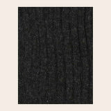 Closeup of charcoal knitted fabric on light background