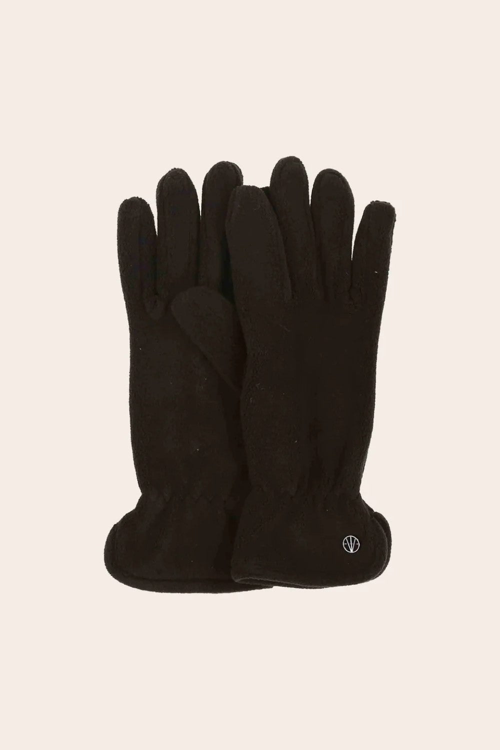 Pair of black gloves on a beige background
