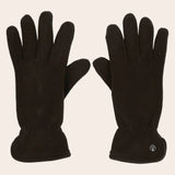 Pair of black gloves on a beige background