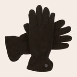 Pair of black gloves on a beige background