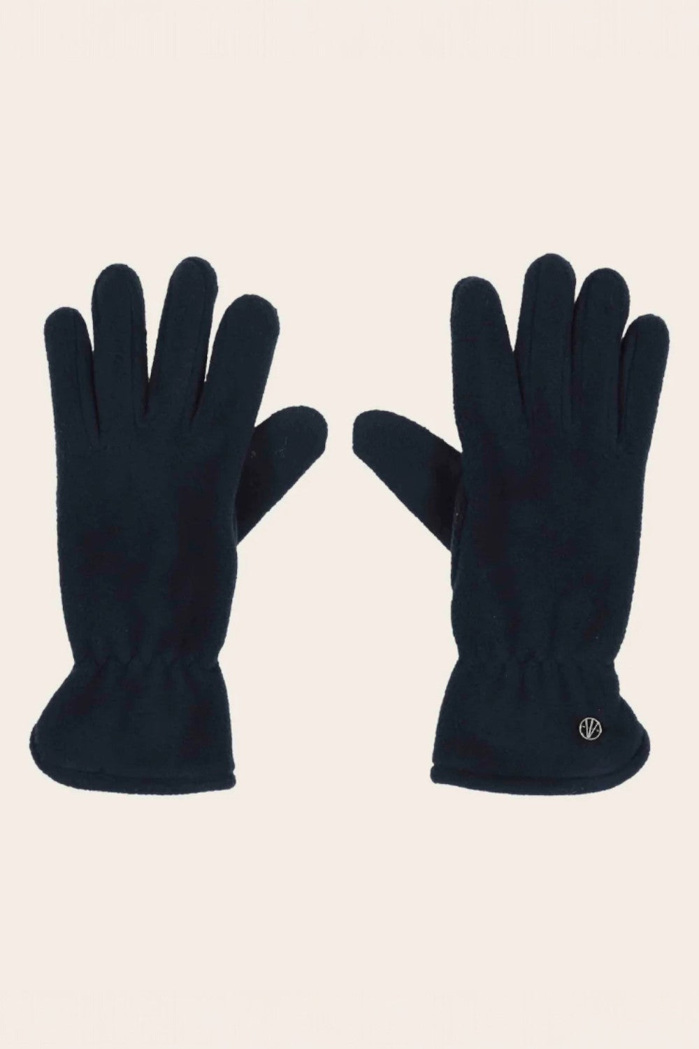 Pair of dark navy gloves on a beige background