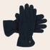 Pair of dark blue gloves on a beige background