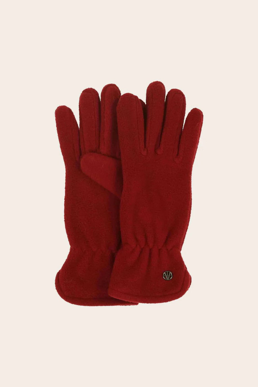 Red gloves on a beige background