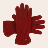 Red gloves with a brand logo on a beige background