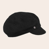 Black cap on a beige background