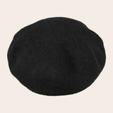 Black cap on a beige background