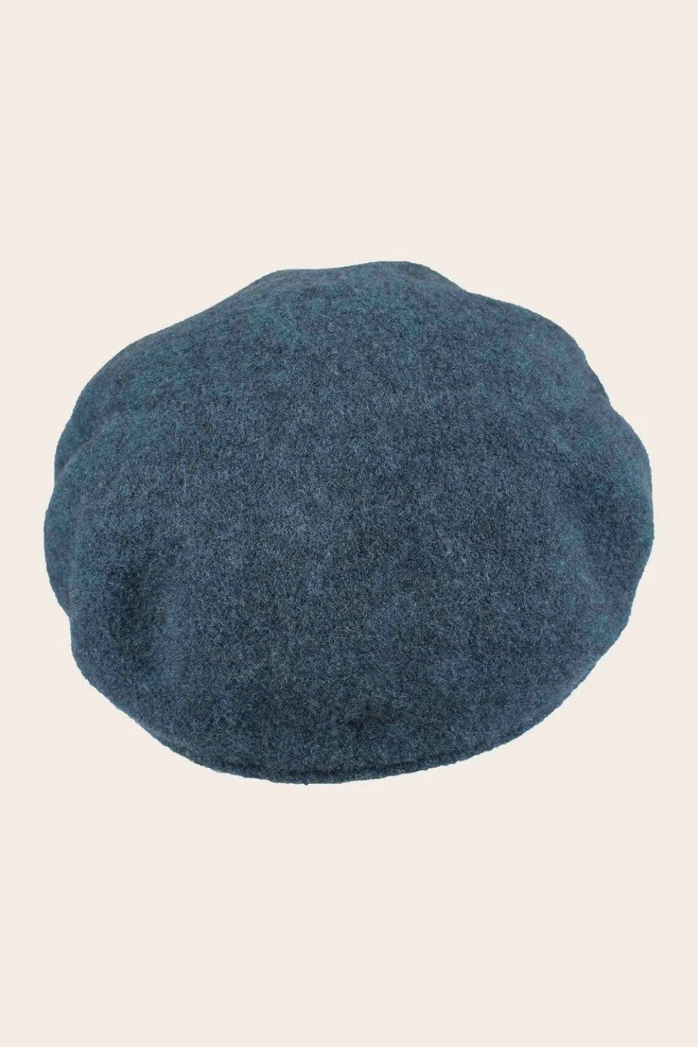 Blue cap on a beige background