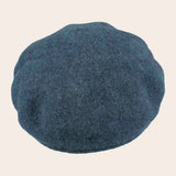 Blue cap on a beige background