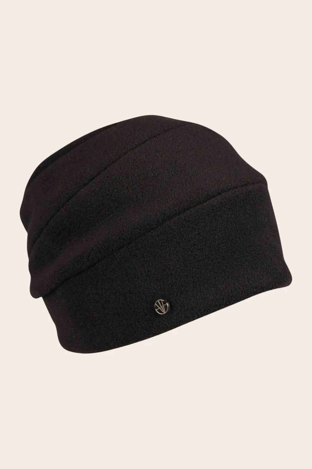 Black beanie hat on a beige background