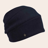 Navy blue beanie with a brand logo on a beige background