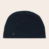 Navy beanie hat on a beige background