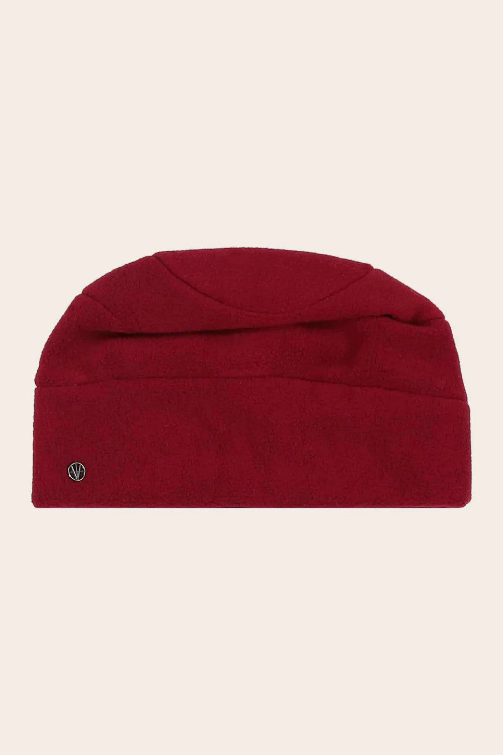 Red beanie hat on a beige background