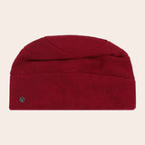 Red beanie hat on a beige background