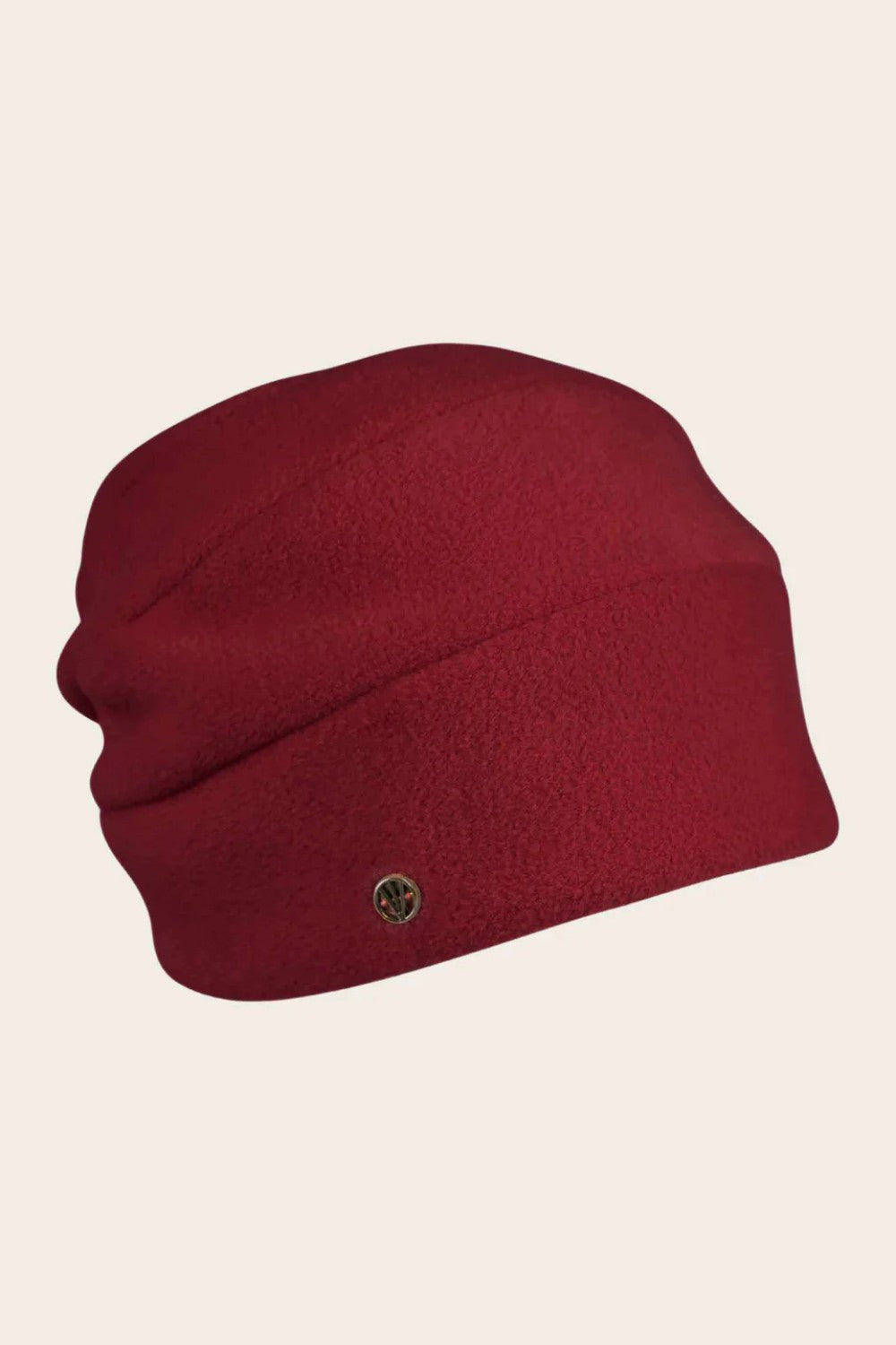 Red beanie hat with a small logo on a beige background