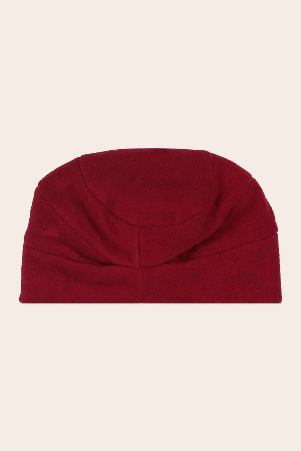 Red beanie on a beige background
