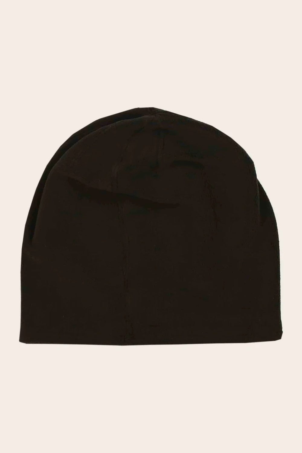 Black beanie hat on a beige background