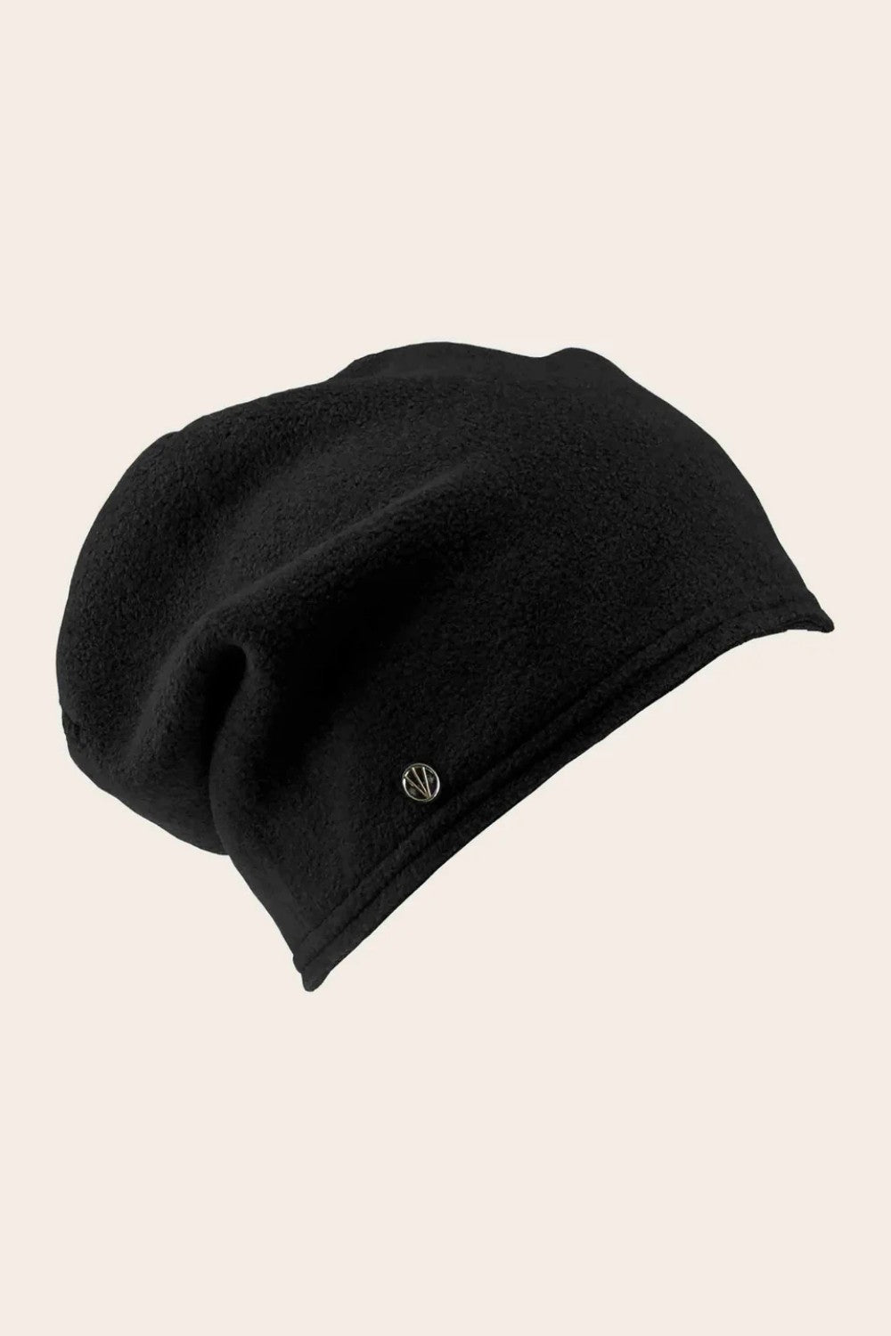 Black beanie hat on a beige background