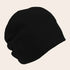 Black beanie hat on a beige background