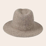 Tan fedora hat on a light beige background