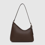 A dark brown pebbled leather shoulder bag with a crescent-shaped silhouette, a single thin strap, and gold-tone hardware, shown against a light gray background.