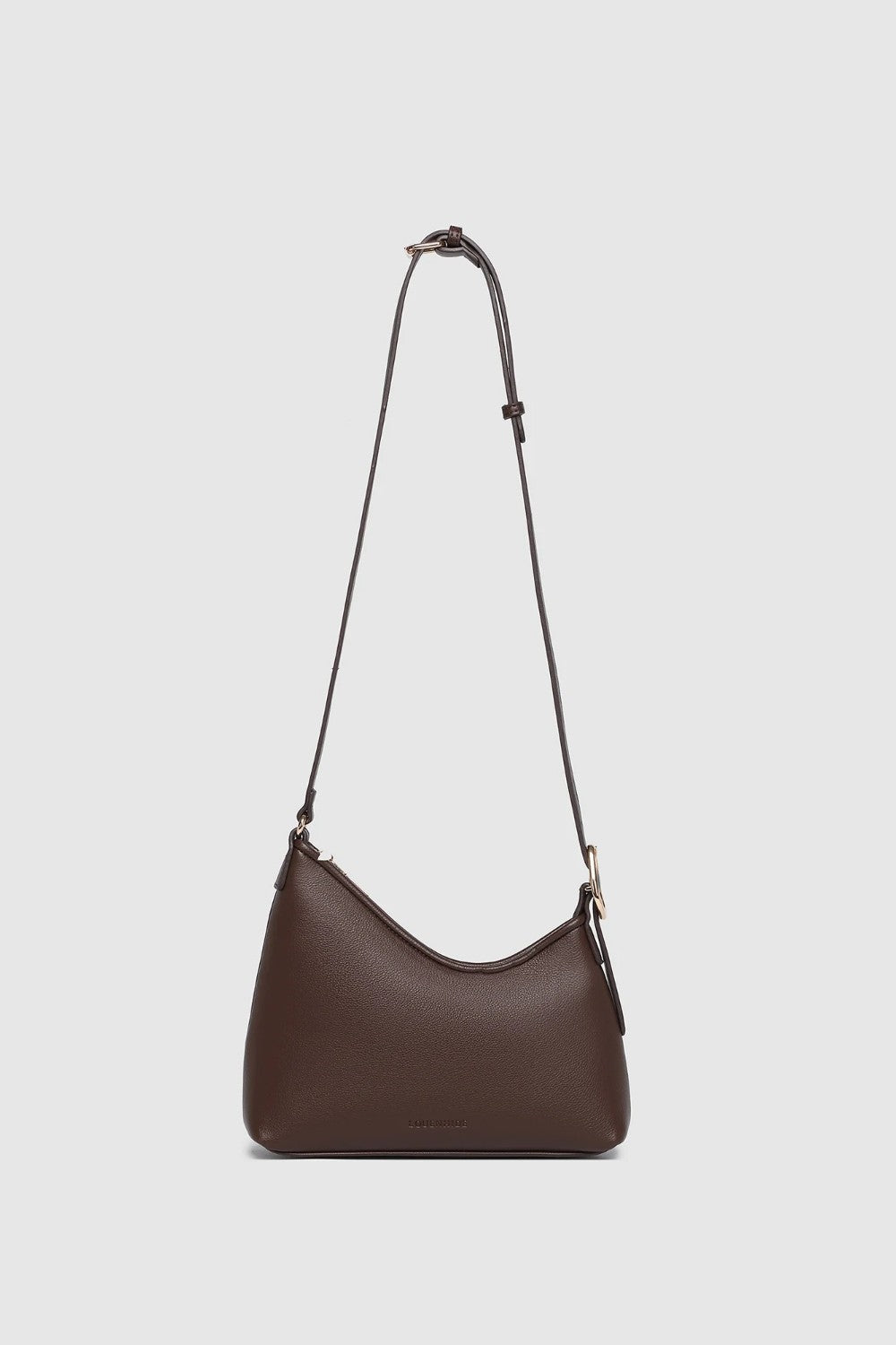 Chocolate brown crossbody handbag on a light background.