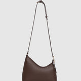 Chocolate brown crossbody handbag on a light background.