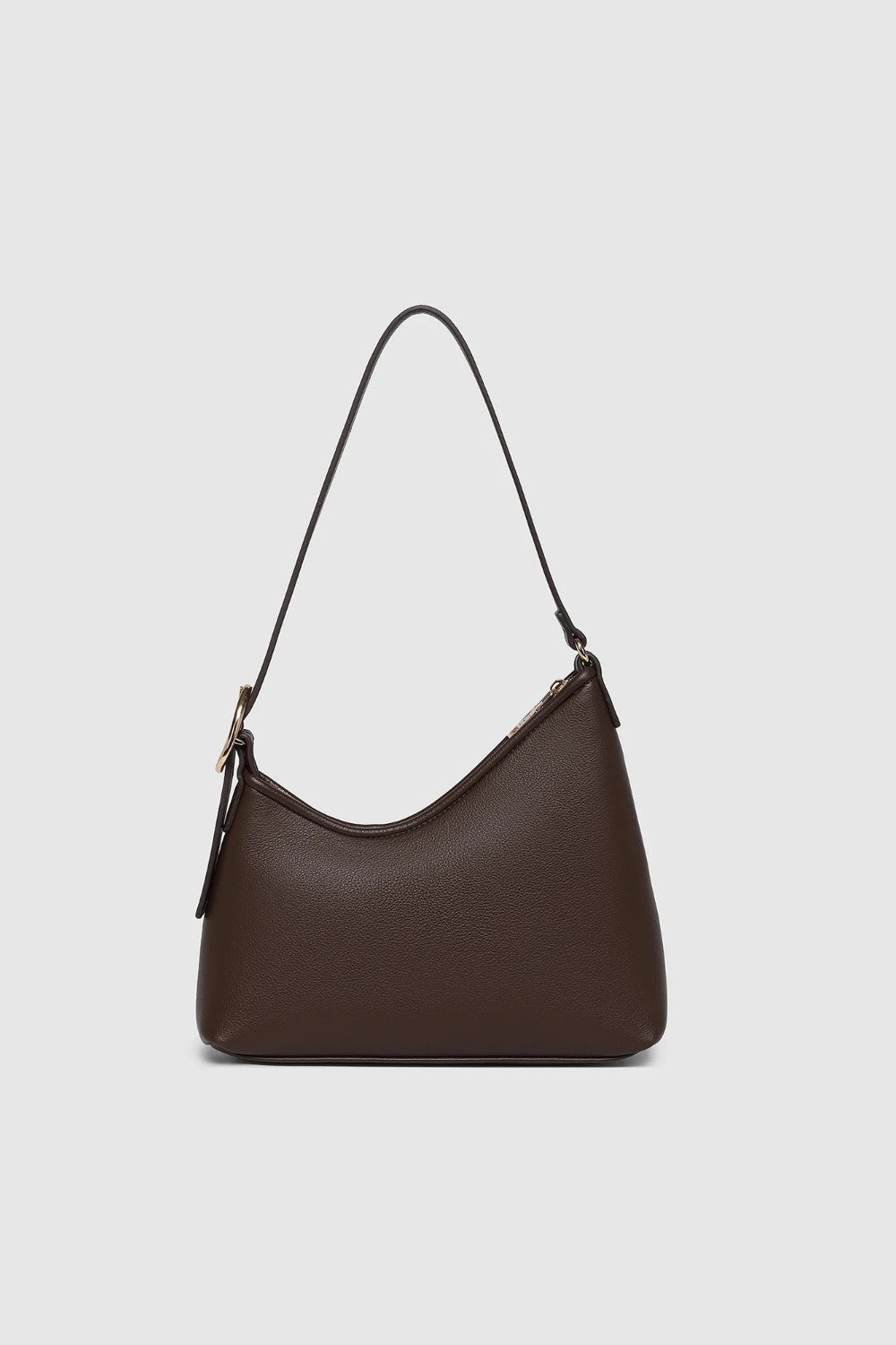A dark brown leather shoulder bag with a crescent-shaped silhouette and a thin black strap, shown against a light gray background.