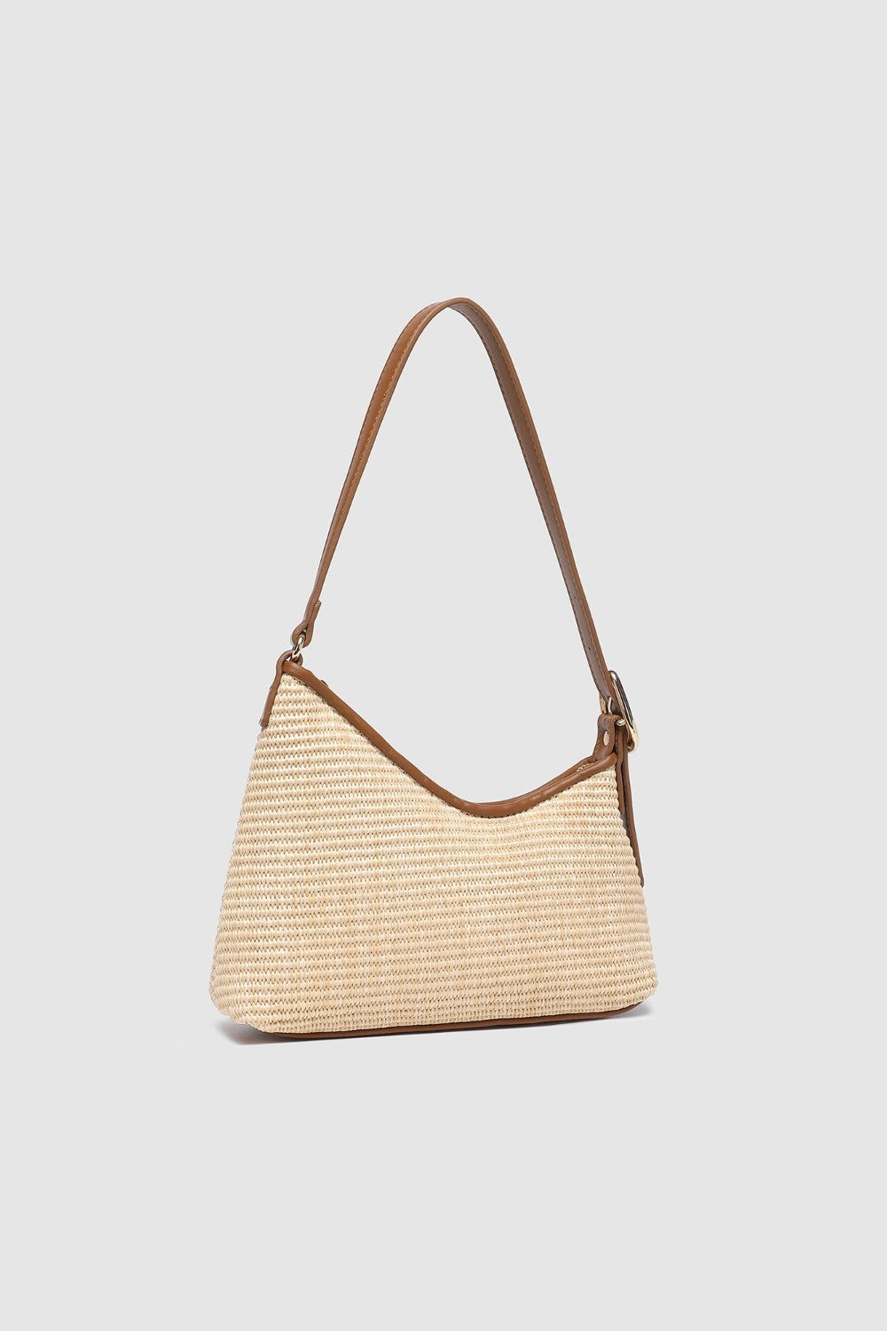 Two tone brown handbag on a light background