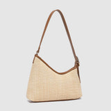 Two tone brown handbag on a light background