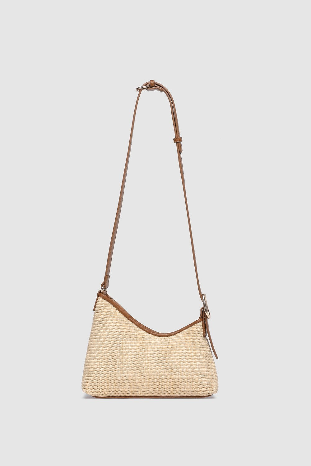 Two tone brown handbag on a light background