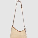 Two tone brown handbag on a light background