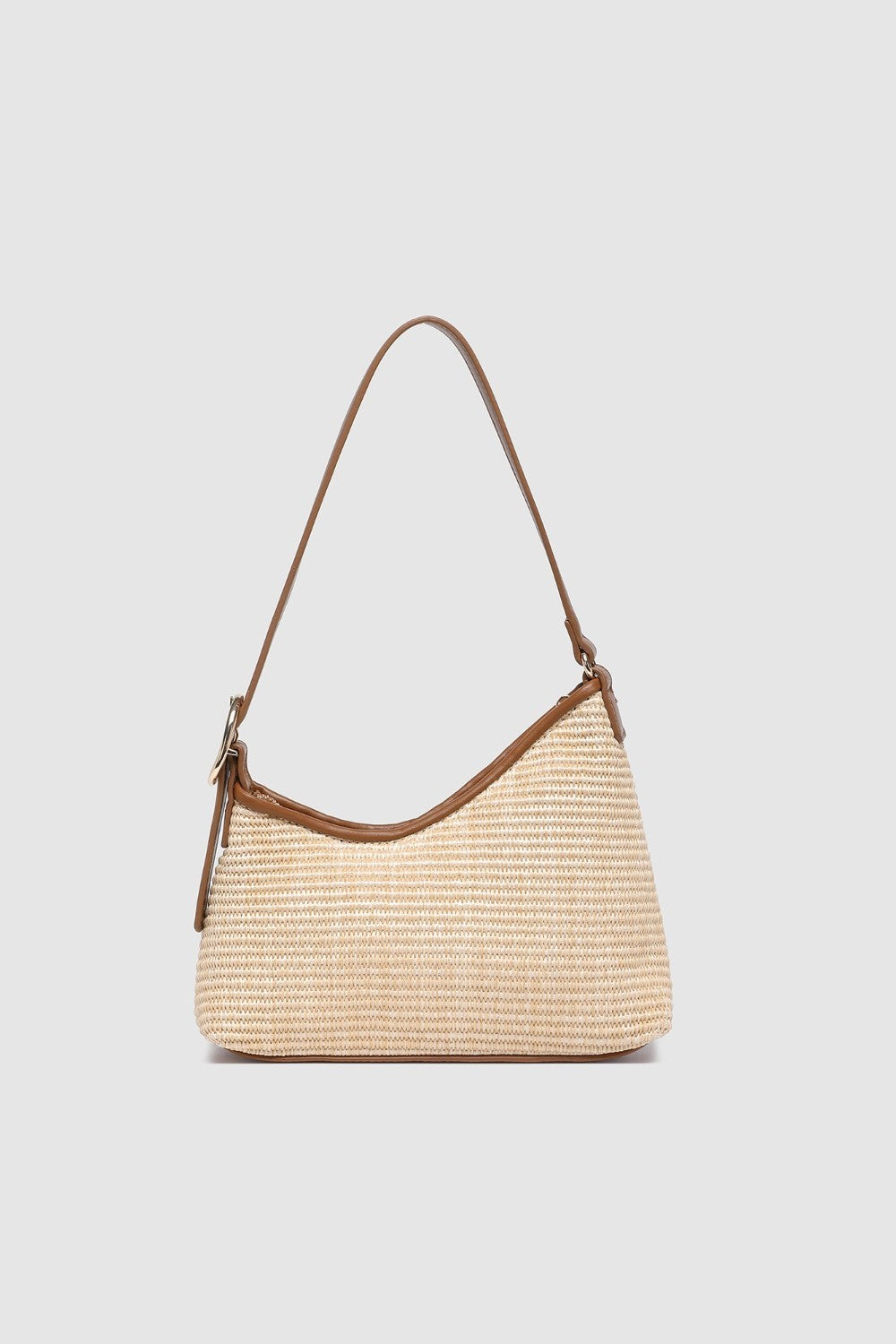 Two tone brown handbag on a light background