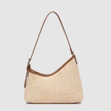 Two tone brown handbag on a light background