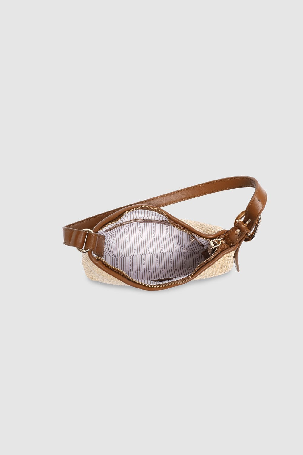 Two tone brown handbag on a light background
