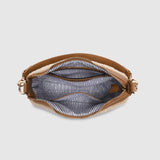 The Louenhide Aspen Shoulder Bag is the soft-structured silhouette your winter wardrobe’s been waiting for. Crafted in a faux shearling texture with warm neutral tones, this sherpa bag brings a subtle warmth to cool-weather dressing. Light gold hardware adds a refined touch to this beige shoulder bag, while the spacious interior easily fits your daily essentials. Whether styled with denim or layered with flowing silhouettes, the Aspen is designed to move with you through the season - statement, elevated, an