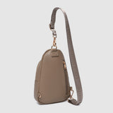 Beige crossbody bag with a strap on a light gray background