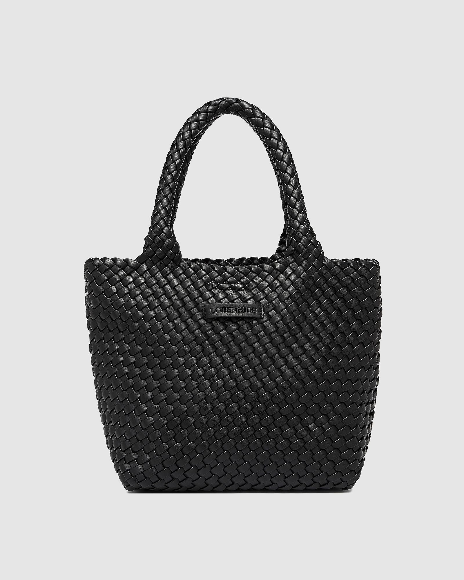 The Louenhide Baby Cruiser Woven Tote Bag is the epitome of laid-back elegance. Following on the woven trend, this women's woven tote bag will add the perfect touch of texture to your capsule wardrobe. Simply carry by the comfortable top handles or attach the adjustable crossbody strap for a hands-free moment when strolling around town. Elevate your style and carry your essentials with the Baby Cruiser Woven Tote Bag.