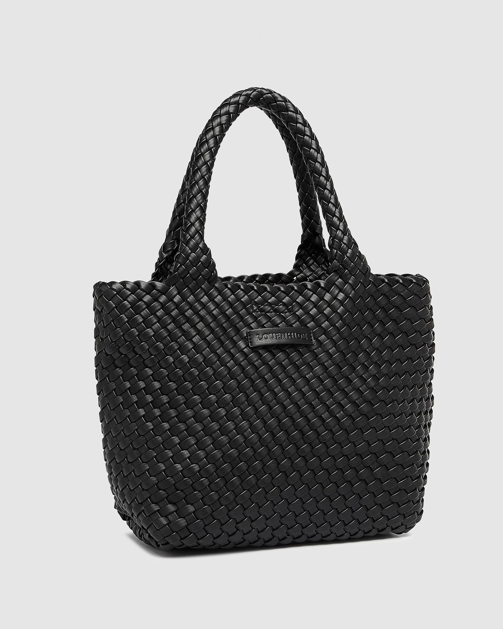 The Louenhide Baby Cruiser Woven Tote Bag is the epitome of laid-back elegance. Following on the woven trend, this women's woven tote bag will add the perfect touch of texture to your capsule wardrobe. Simply carry by the comfortable top handles or attach the adjustable crossbody strap for a hands-free moment when strolling around town. Elevate your style and carry your essentials with the Baby Cruiser Woven Tote Bag.