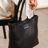 The Louenhide Baby Cruiser Woven Tote Bag is the epitome of laid-back elegance. Following on the woven trend, this women's woven tote bag will add the perfect touch of texture to your capsule wardrobe. Simply carry by the comfortable top handles or attach the adjustable crossbody strap for a hands-free moment when strolling around town. Elevate your style and carry your essentials with the Baby Cruiser Woven Tote Bag.