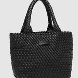 Black woven handbag with handle on a white background
