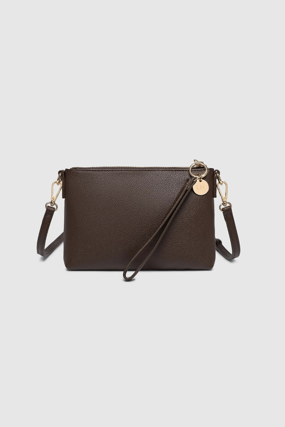 A dark brown faux-leather crossbody bag with a matching wristlet strap and gold-tone hardware, displayed on a light gray background.