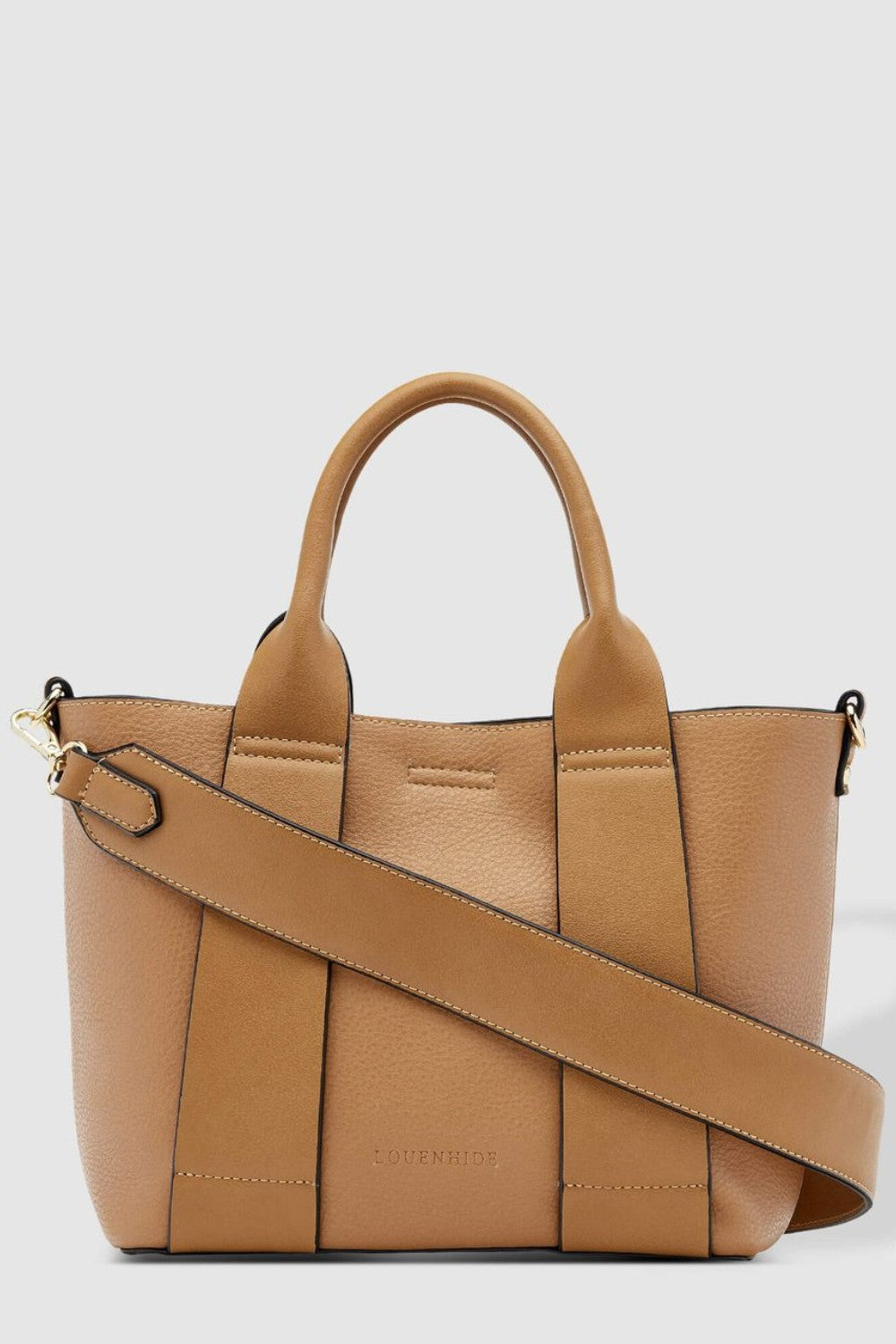 Tan handbag with a shoulder strap on a light gray background