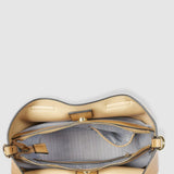 Tan handbag with open flap on a light gray background