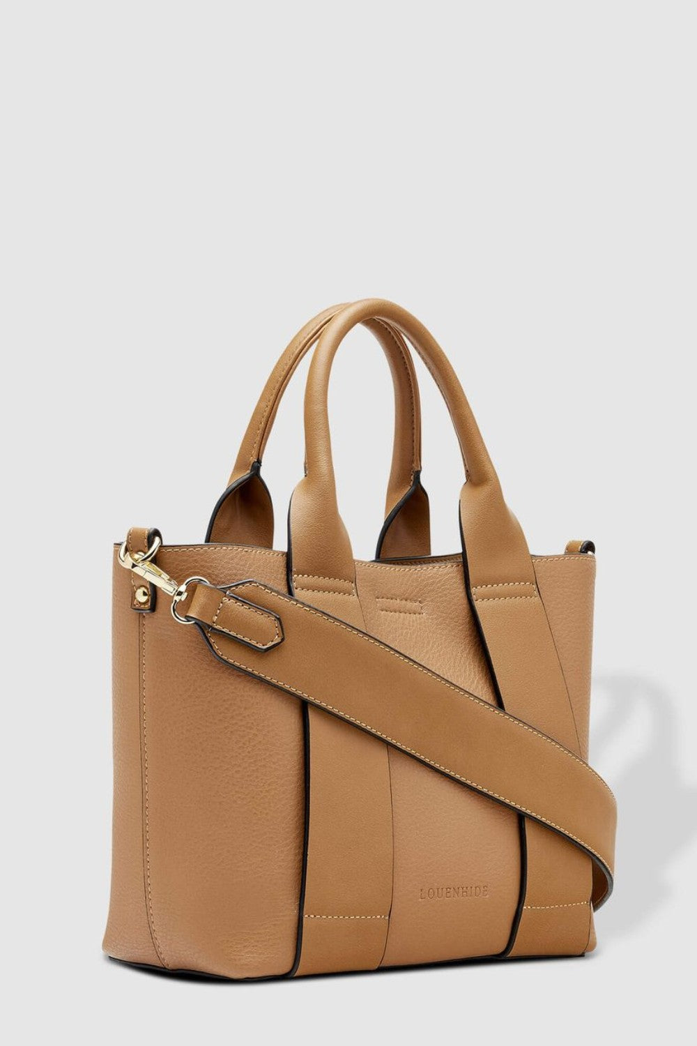 Tan handbag with a shoulder strap on a light gray background