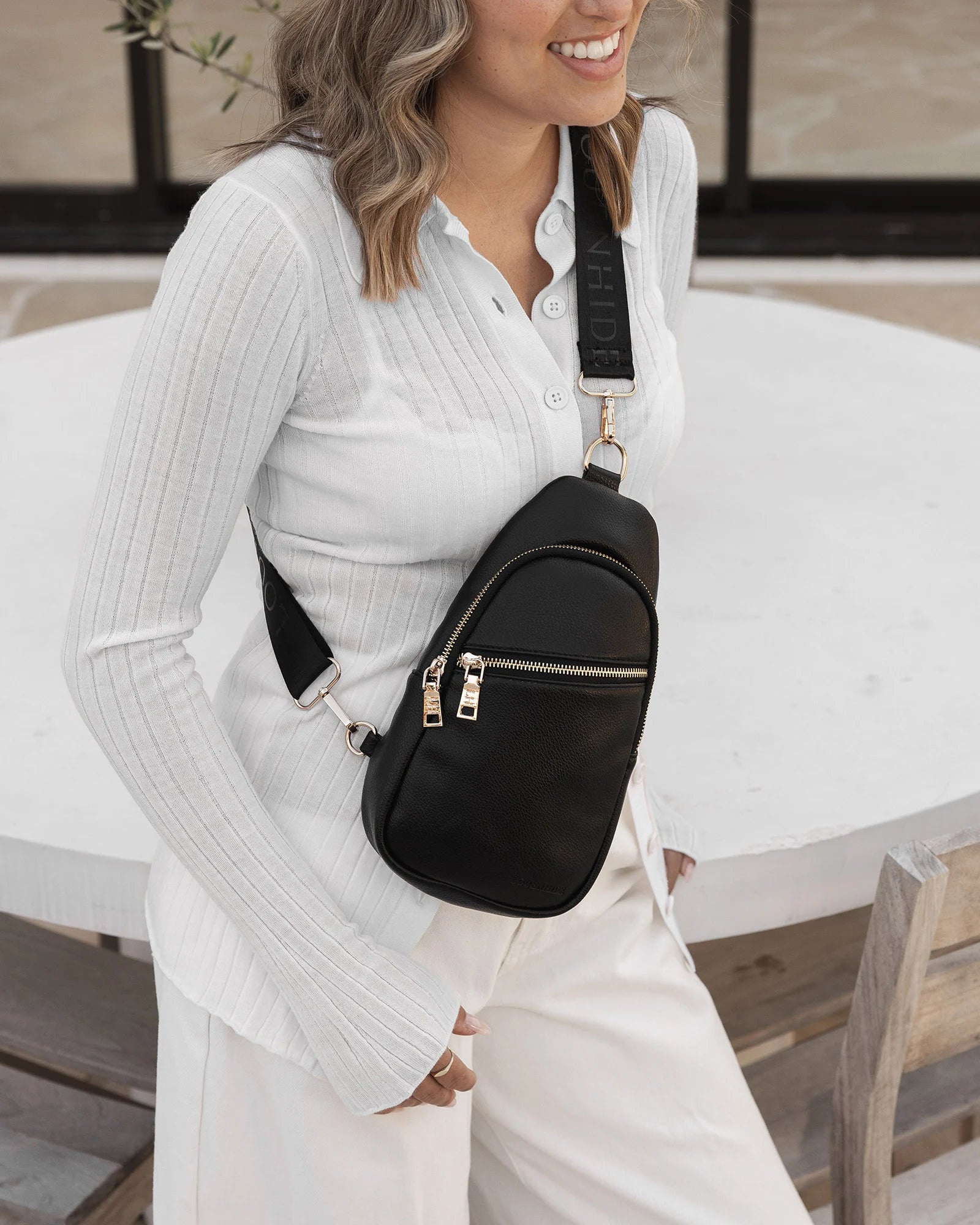 The Louenhide Bella Sling Bag is designed with both style and functionality in mind. Travel organization has never been easier with the dual compartment design ensuring your valuables are within reach and secured safely with the zip closures. Featuring an adjustable and detachable strap allows you to choose the way your bag slings. Whether over your left or right shoulder, this faux leather sling bag ensures comfortable all-day wear. This small sling backpack adds a refined touch to any casual outfit, enhan